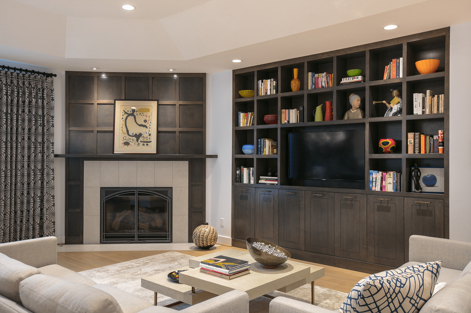 Flat screen TV on brown wooden home entertainment center