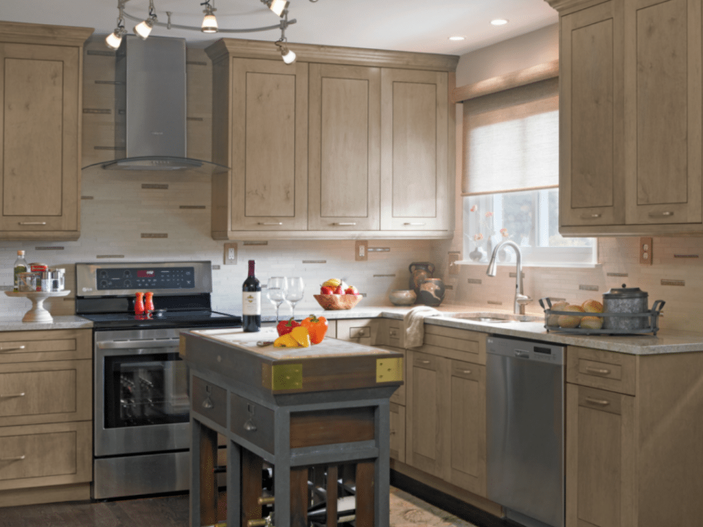 Gray and black induction range on kitchen cabinet