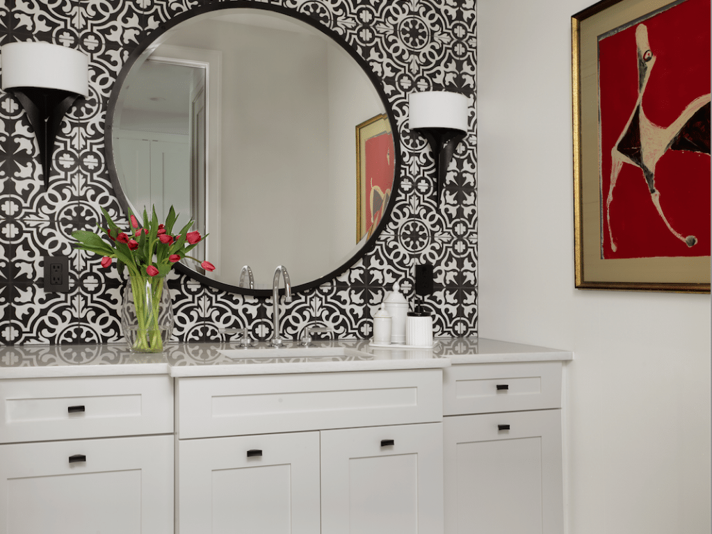White, black and a touch of red is classic, timeless and always on point, as in this striking powder room I designed for a client who wasn't afraid to push the design envelope. Design by Marcia Moore Photo by Alise O’Brien