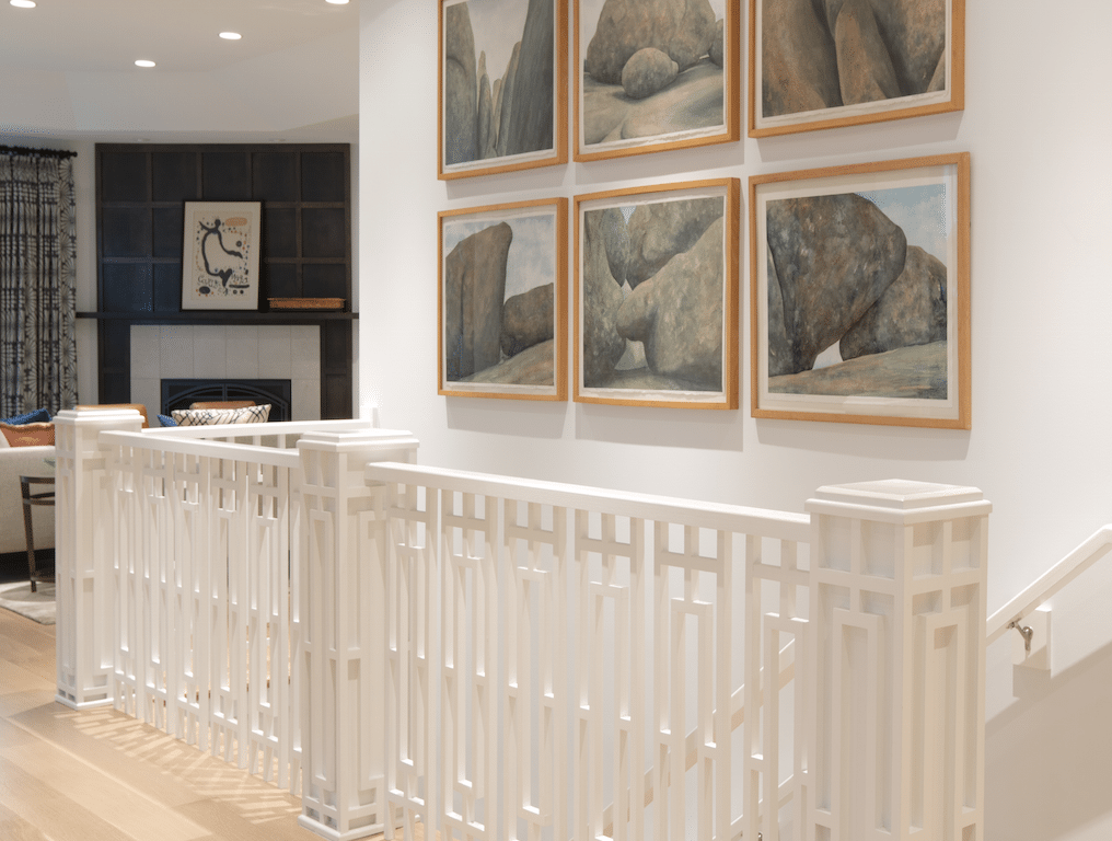 White walls allow artwork to take center stage as in this gallery of prints we created in a new home. Design by Marcia Moore Photo by Suzy Gorman