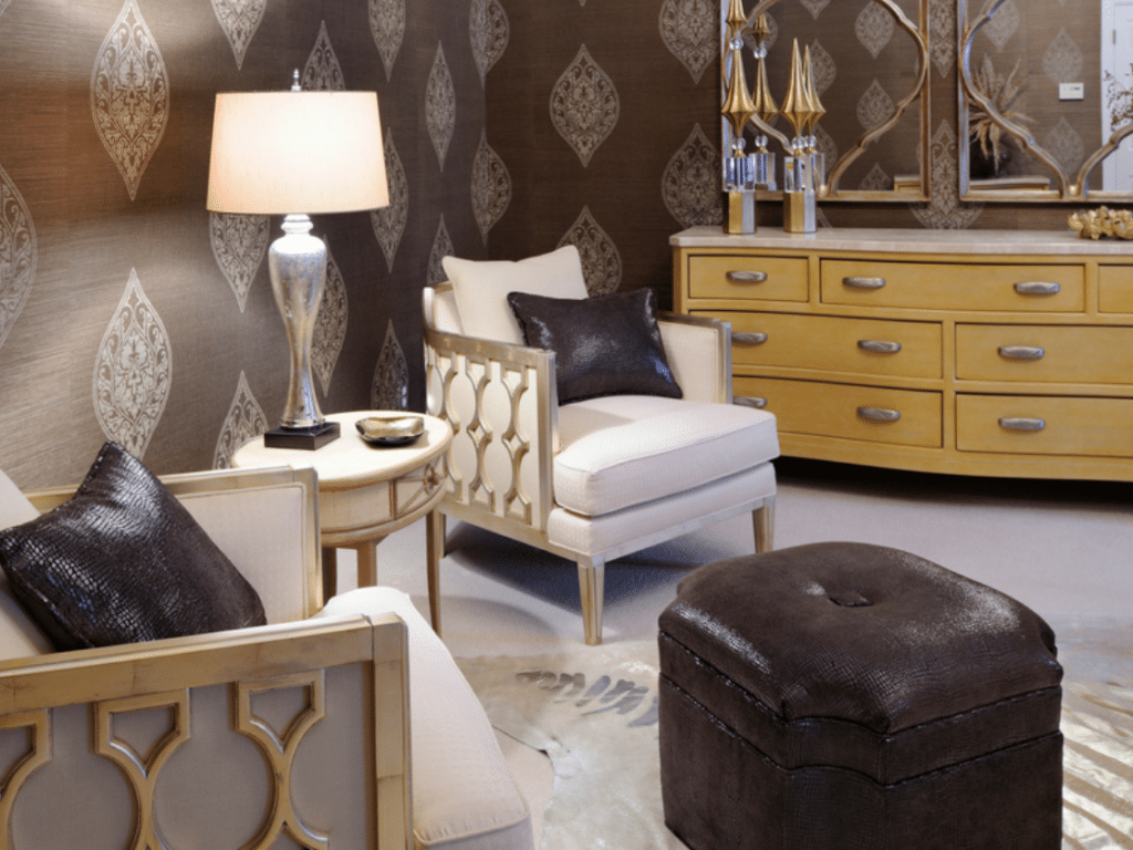 Two white fabric sofa chairs beside white table lamp on white wooden end table