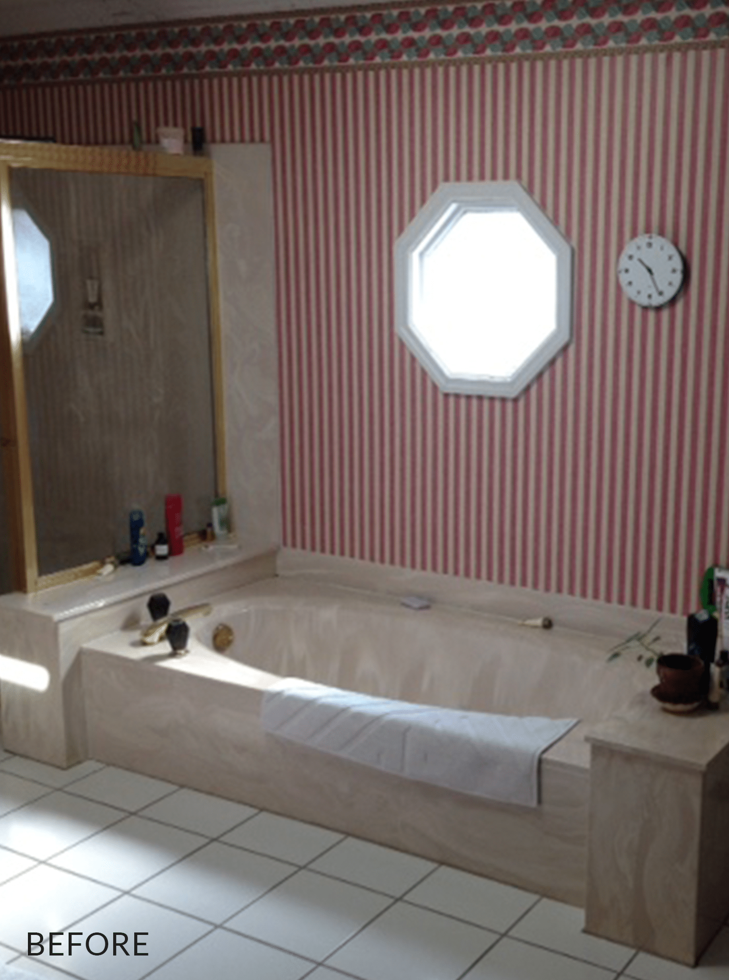 marble bath tub below octagon window