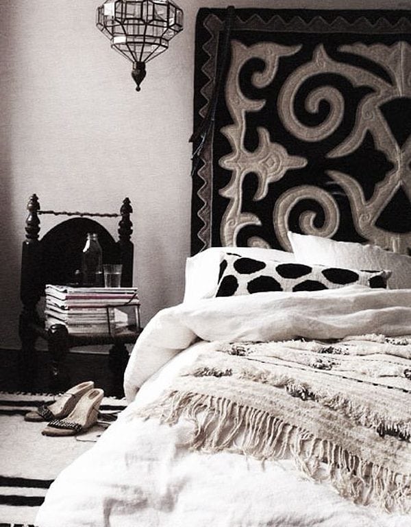 Black and beige headboard and mattress near wall