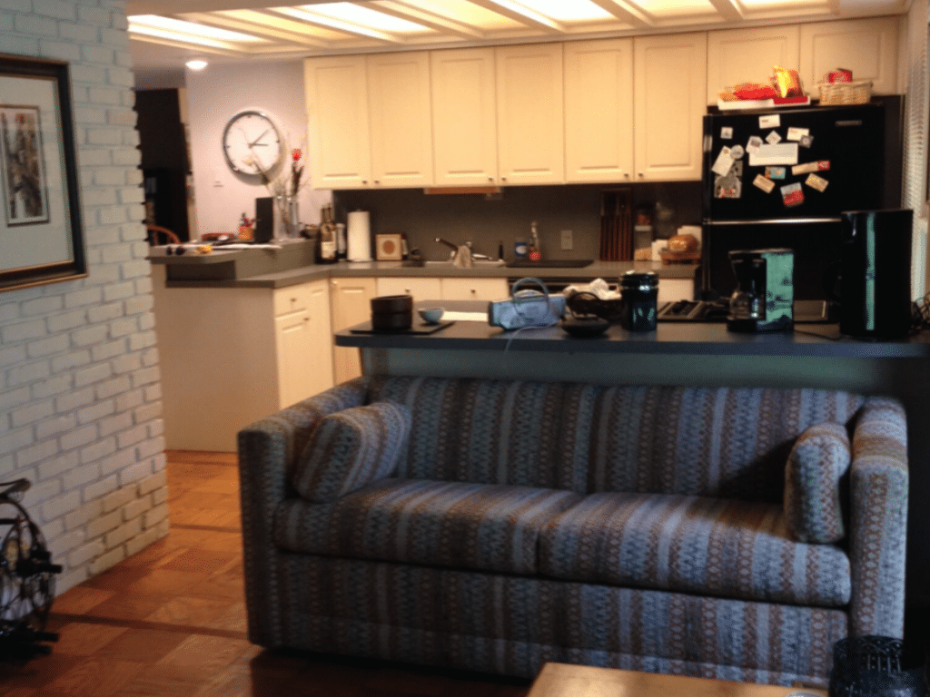 Gray and brown 2-seat couch next to kitchen island