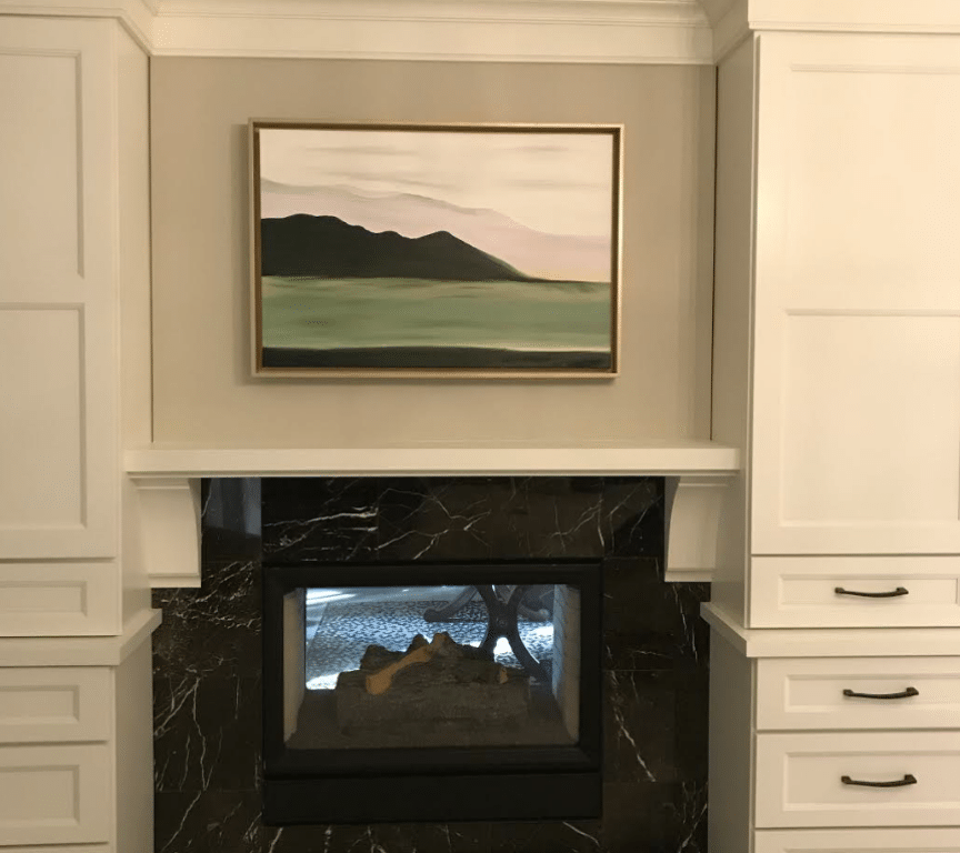 Turned-off black electric fireplace inside white-painted room