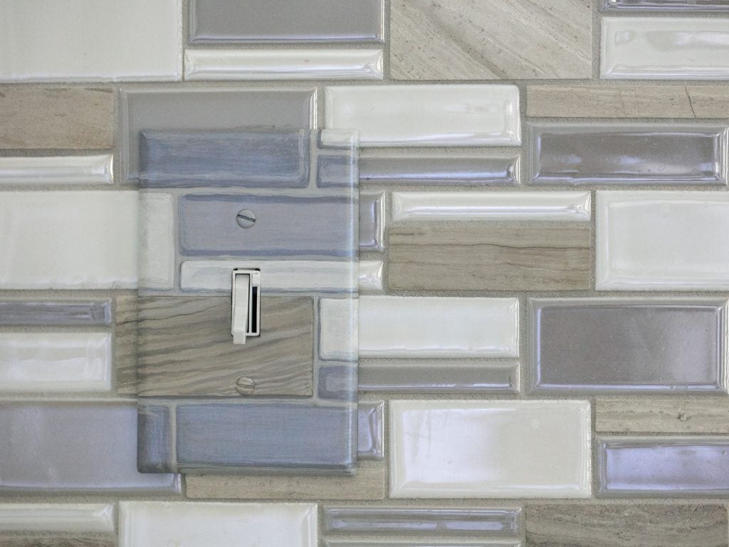 Gray and beige light switch